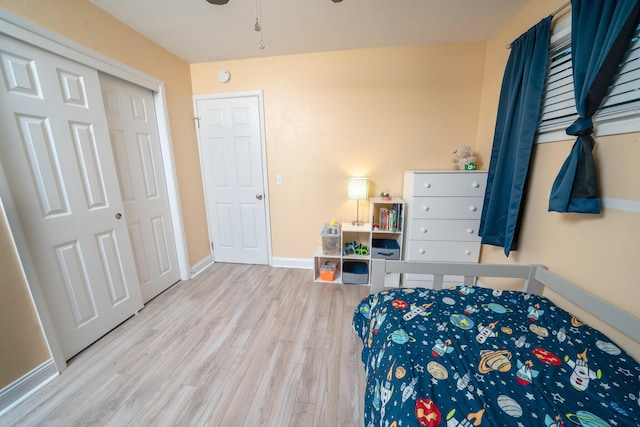 bedroom featuring light hardwood / wood-style floors and a closet