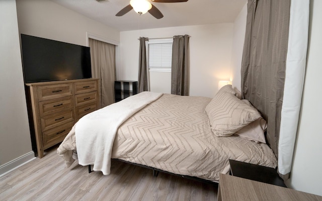 bedroom featuring ceiling fan and light hardwood / wood-style flooring