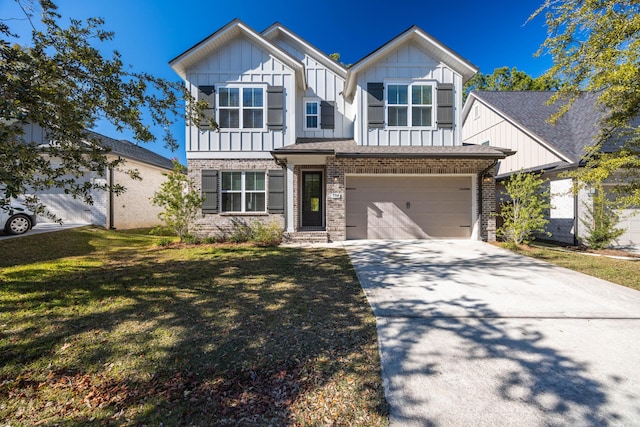 view of front of home with a front yard and a garage