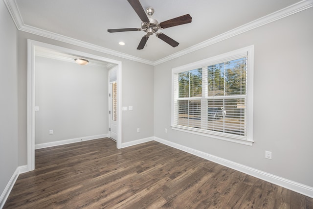 spare room featuring crown molding, dark hardwood / wood-style flooring, and ceiling fan