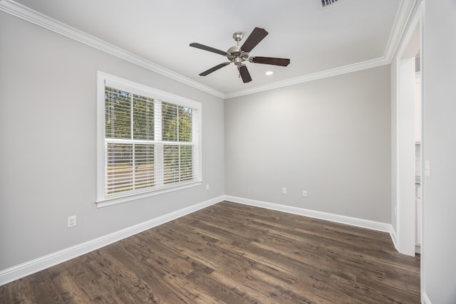 empty room featuring ceiling fan, dark hardwood / wood-style flooring, and crown molding