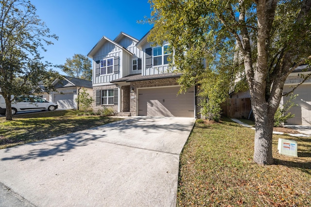 view of front of house featuring a front yard and a garage