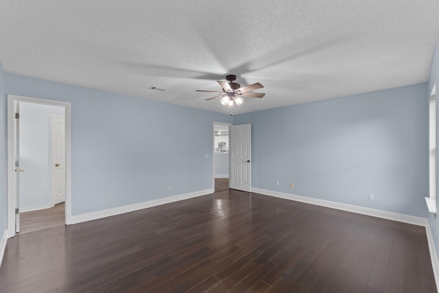 unfurnished room with ceiling fan, dark hardwood / wood-style flooring, and a textured ceiling