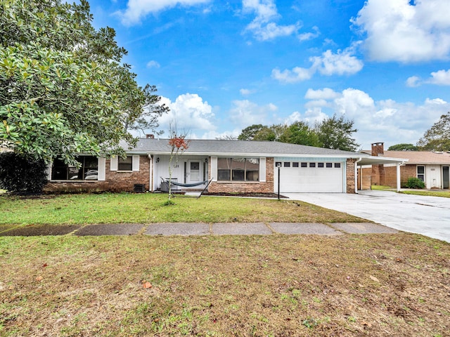 ranch-style house featuring a front yard, a garage, and a carport