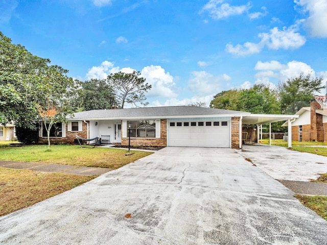 ranch-style house with a carport, a garage, and a front yard