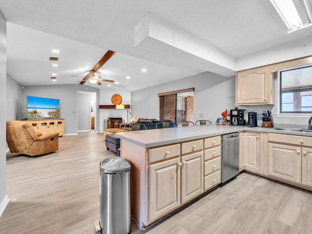 kitchen featuring light hardwood / wood-style floors, stainless steel dishwasher, kitchen peninsula, and lofted ceiling