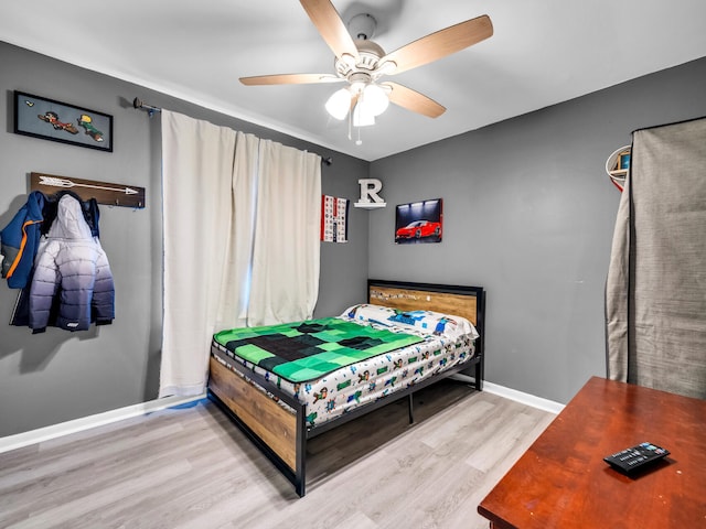 bedroom featuring ceiling fan and light wood-type flooring