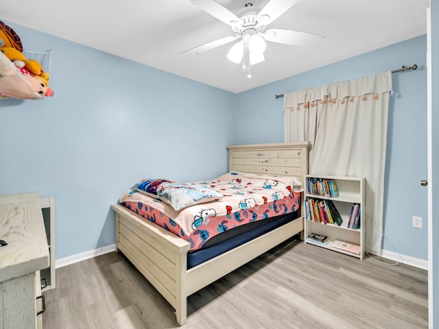 bedroom with ceiling fan and hardwood / wood-style floors