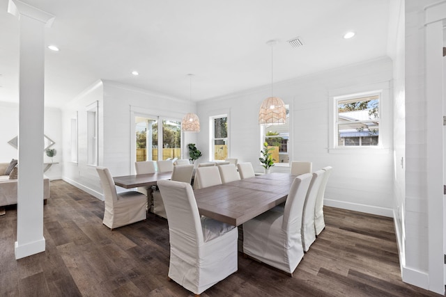 dining room with dark hardwood / wood-style floors and ornamental molding