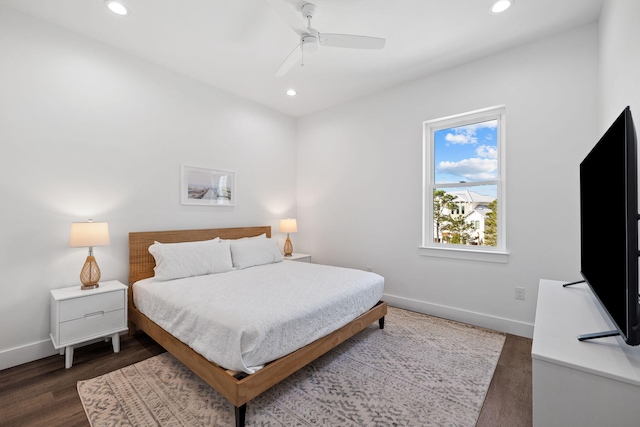 bedroom featuring dark hardwood / wood-style flooring and ceiling fan