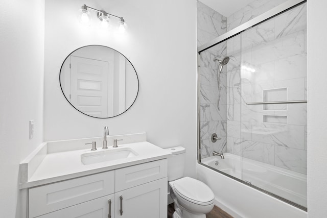 full bathroom with toilet, vanity, and combined bath / shower with glass door