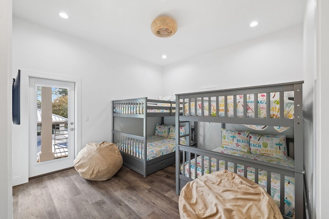 bedroom featuring hardwood / wood-style floors and access to exterior