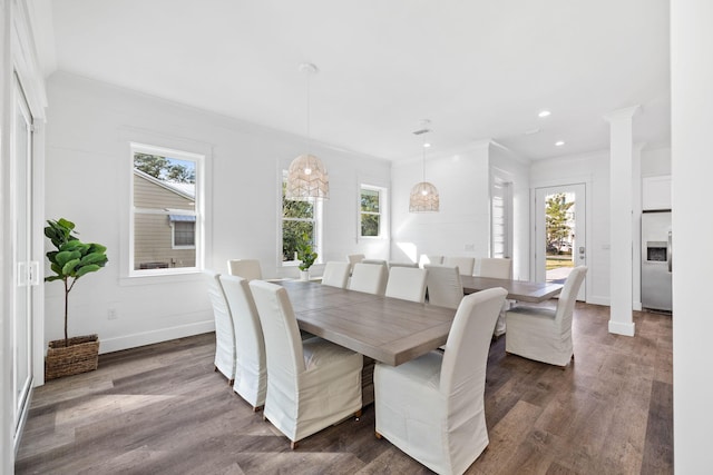 dining room with a wealth of natural light and crown molding