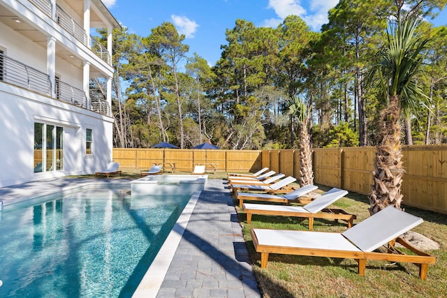 view of swimming pool with a patio area