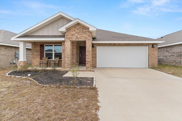 view of front of home featuring covered porch and a garage