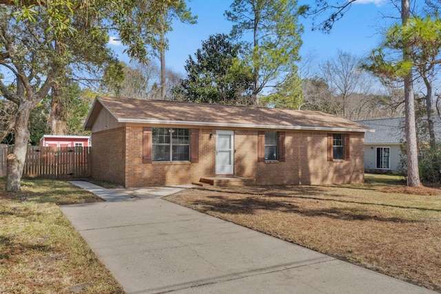 ranch-style home with a front yard