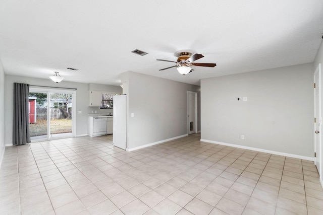 unfurnished living room featuring ceiling fan and light tile patterned floors