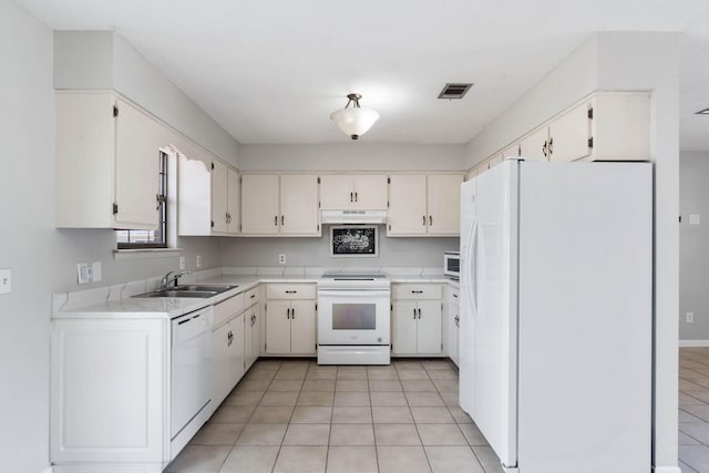 kitchen featuring white appliances, sink, and white cabinets