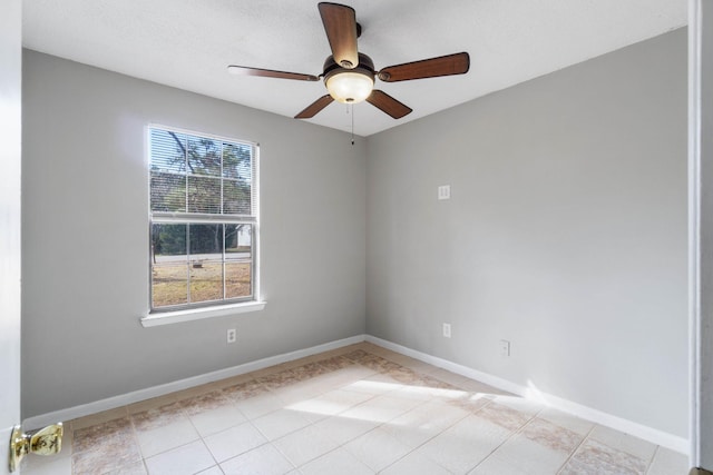 spare room with ceiling fan