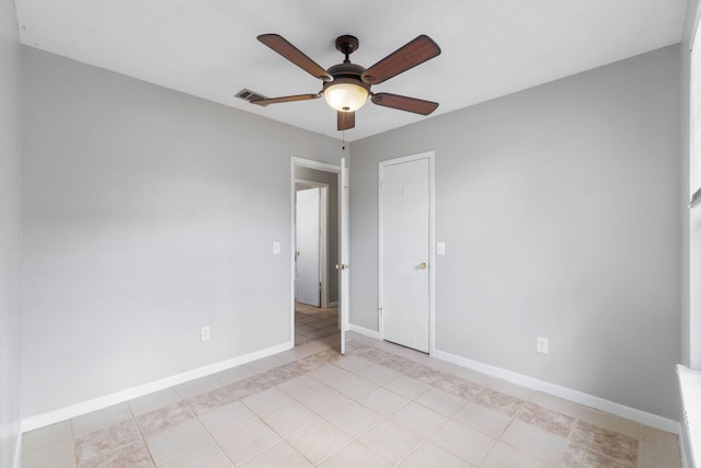 spare room with ceiling fan