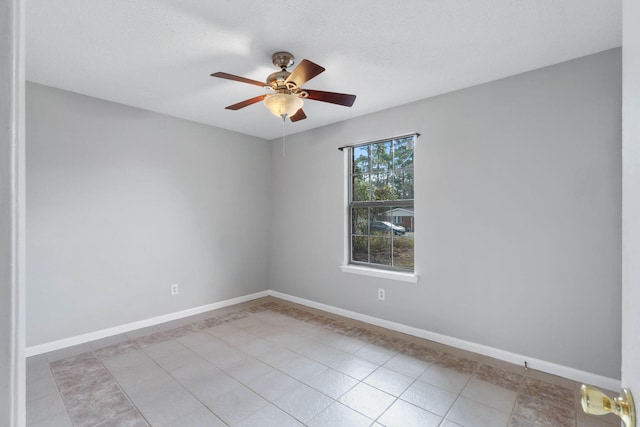 spare room with ceiling fan