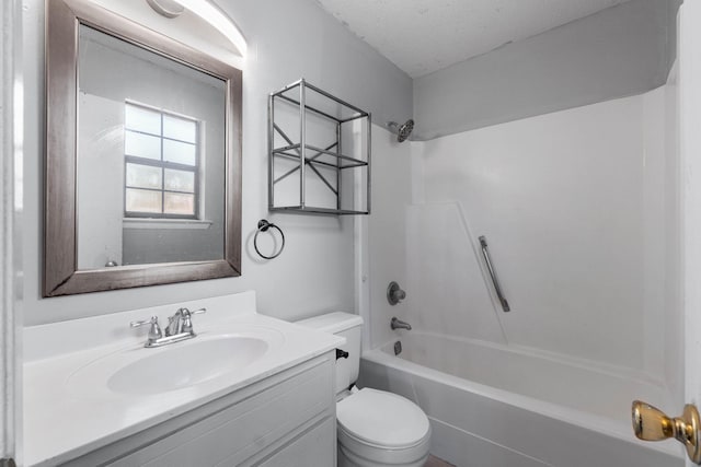 full bathroom featuring shower / bath combination, vanity, a textured ceiling, and toilet