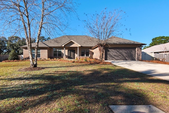 ranch-style home featuring a front yard and a garage