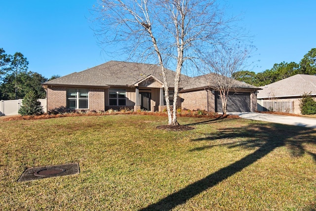 ranch-style house with a garage and a front yard