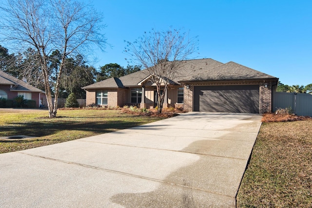 view of front of house featuring a front lawn and a garage