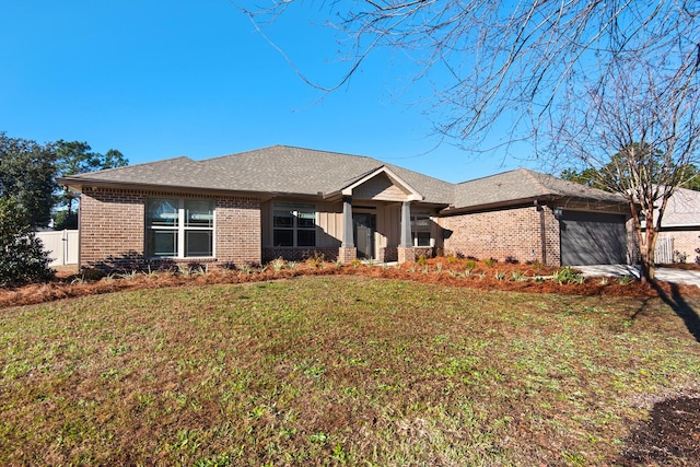 view of front facade with a garage and a front lawn