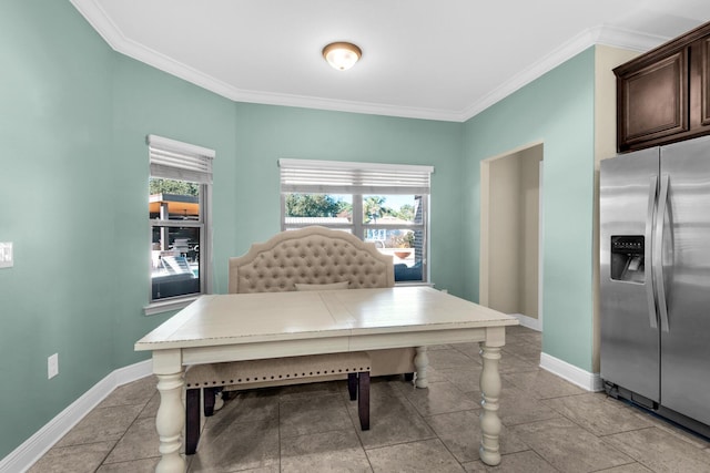 dining area with crown molding