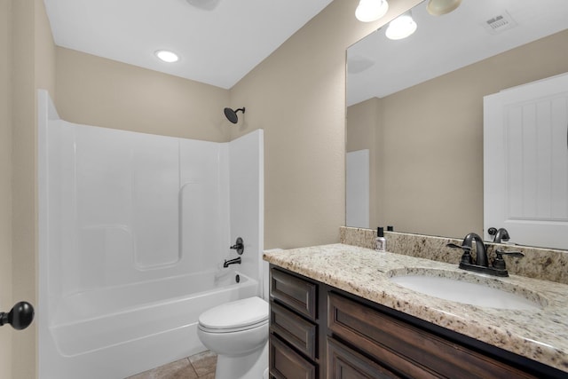 full bathroom with toilet, vanity, tile patterned floors, and  shower combination