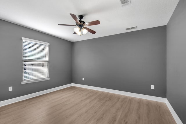 unfurnished room featuring ceiling fan and wood-type flooring