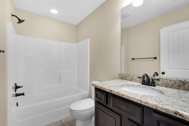 full bathroom featuring toilet, tile patterned flooring, vanity, and washtub / shower combination