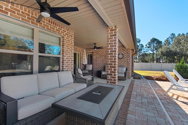 view of patio / terrace with ceiling fan and an outdoor living space