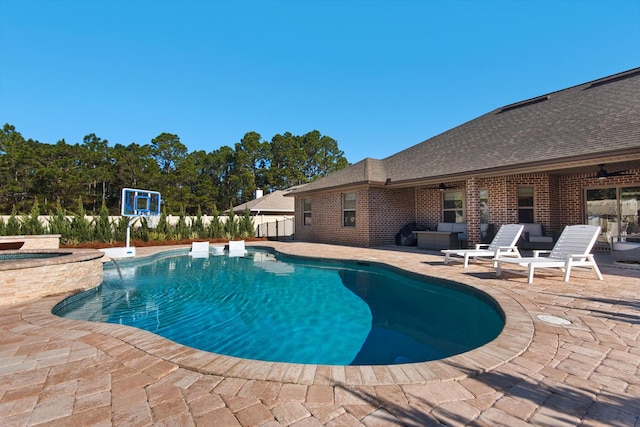 view of pool with ceiling fan, an in ground hot tub, and a patio area