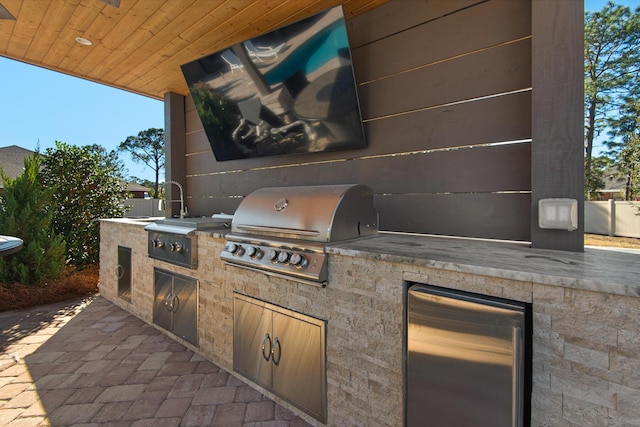 view of patio with a grill and area for grilling