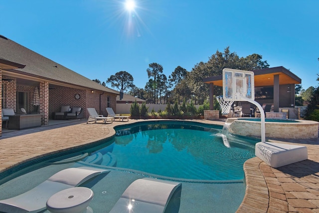 view of swimming pool with pool water feature and a patio area