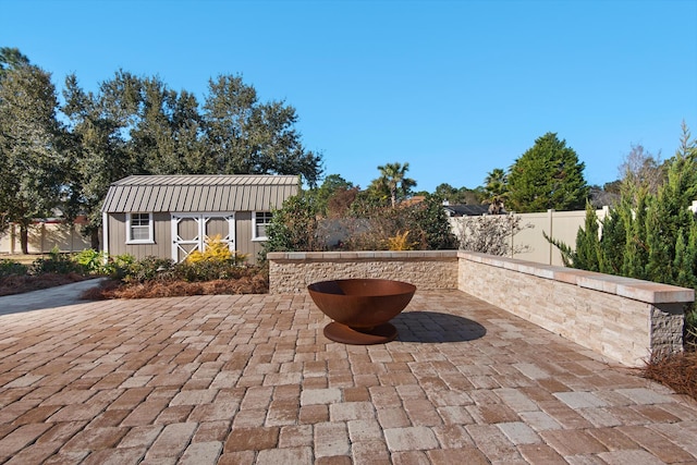 view of patio / terrace with a shed