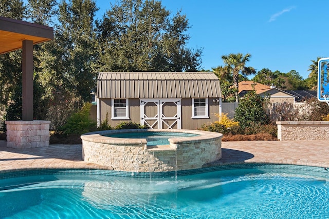 view of pool with a shed