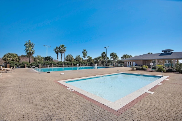 view of swimming pool with a patio area