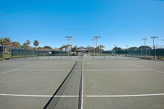 view of tennis court with a gazebo