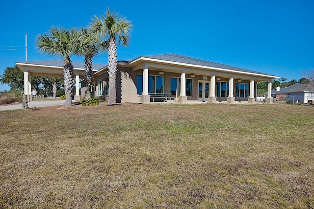 back of house featuring a yard