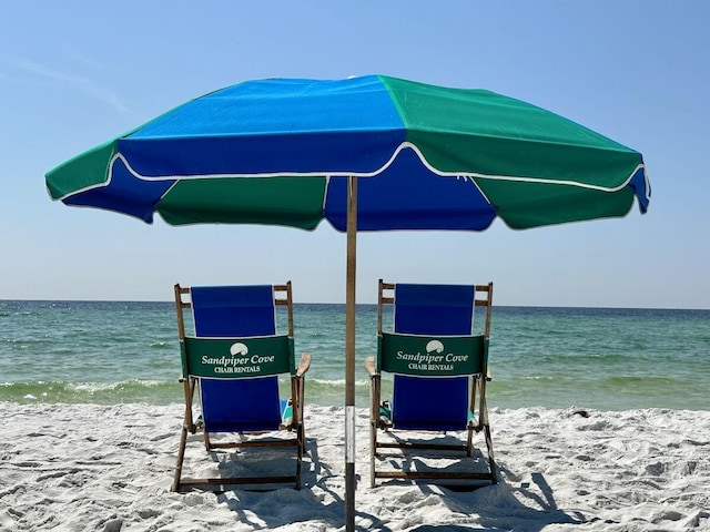 dock area featuring a view of the beach and a water view