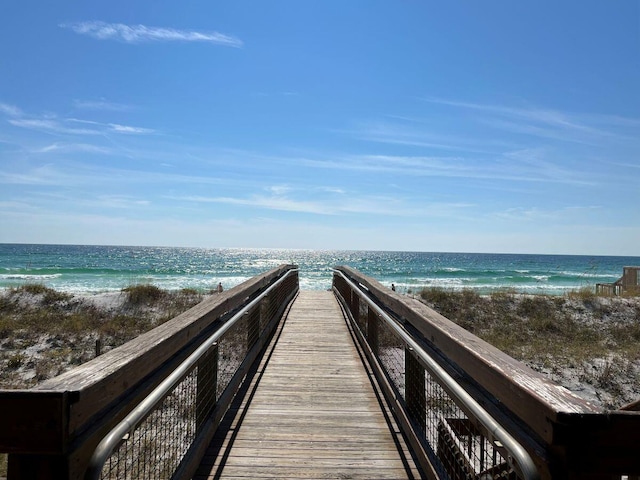 view of property's community with a view of the beach and a water view