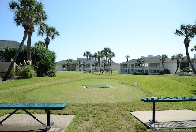 surrounding community featuring a yard