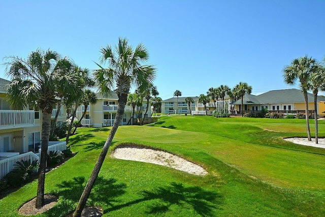 view of property's community with a yard