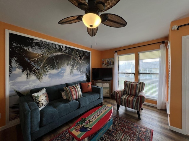 living room with wood-type flooring and ceiling fan