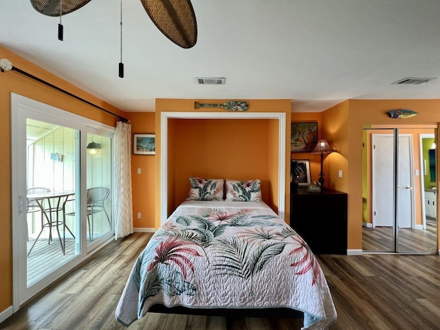 bedroom with access to exterior and hardwood / wood-style flooring