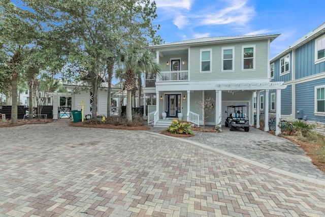 view of front of home with a balcony and covered porch